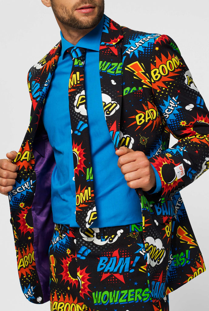 Black suit with comic book icons worn by man shown inside jacket