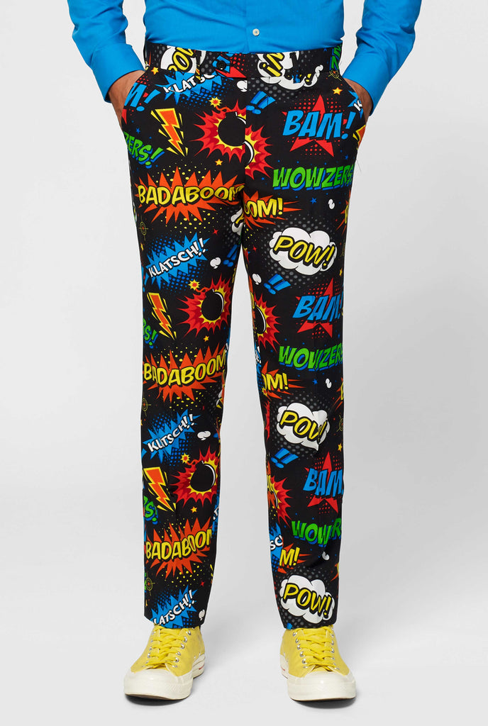 Black suit with comic book icons worn by man close up pants