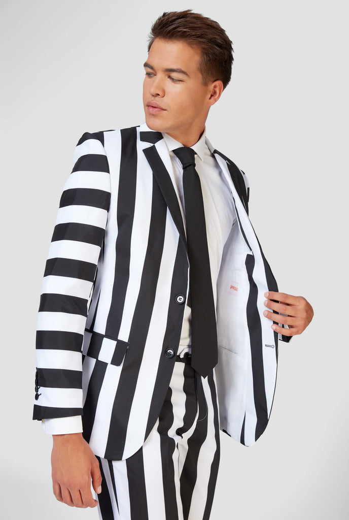 Black and white striped Beetlejuice men's suit worn by man - close up