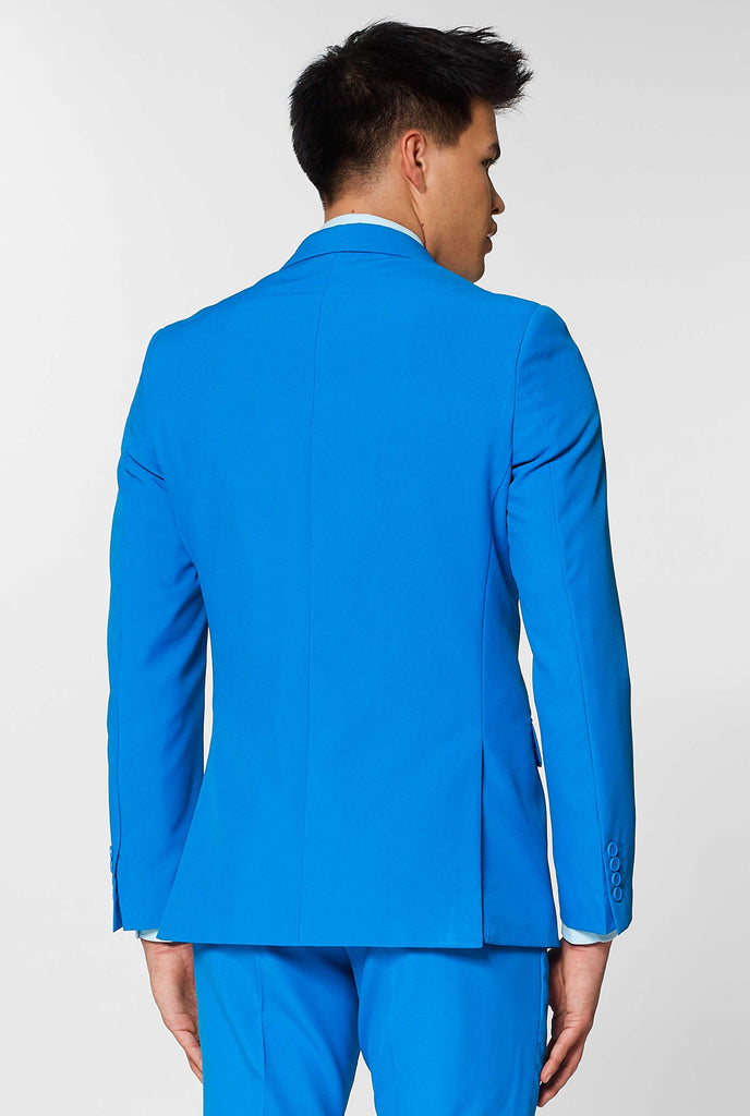 Man wearing blue men's suit, view from the back