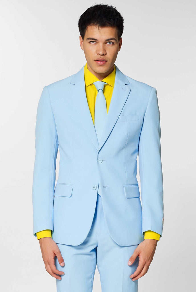 Man wearing light blue men's suit and yellow dress shirt