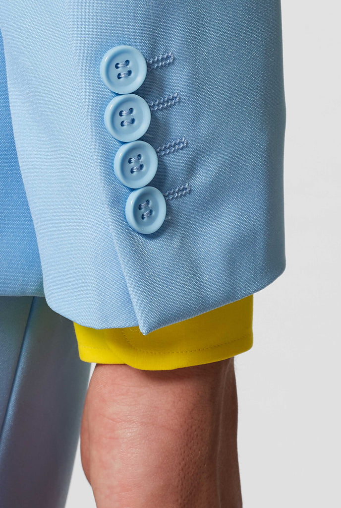 Man wearing light blue men's suit and yellow dress shirt, sleeve close up