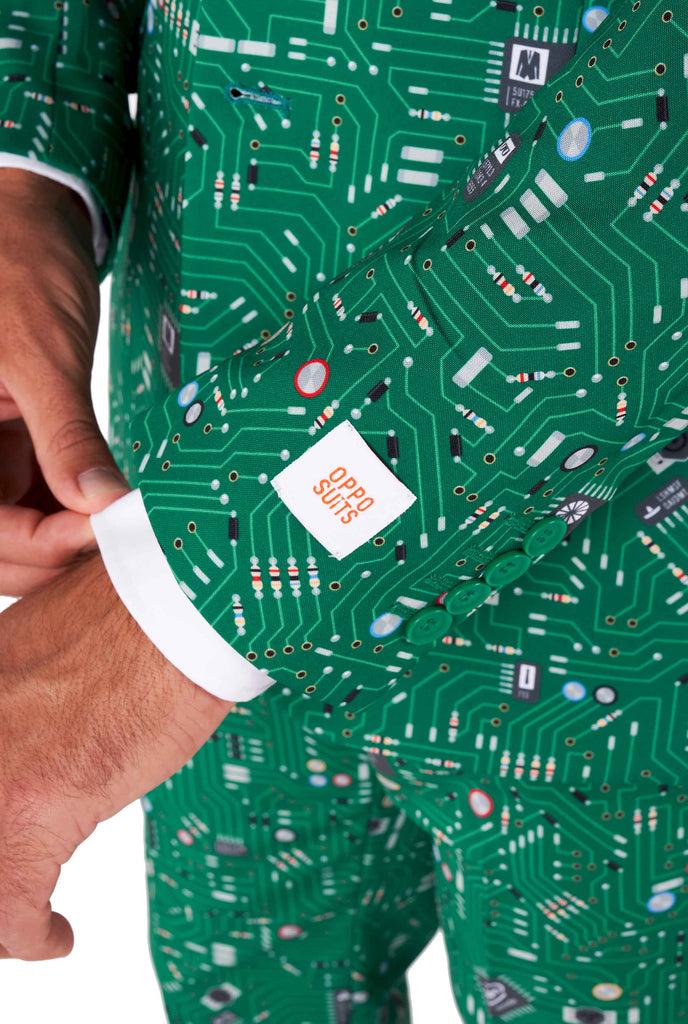 Man wearing men's suit with circuit board print, sleeve close up