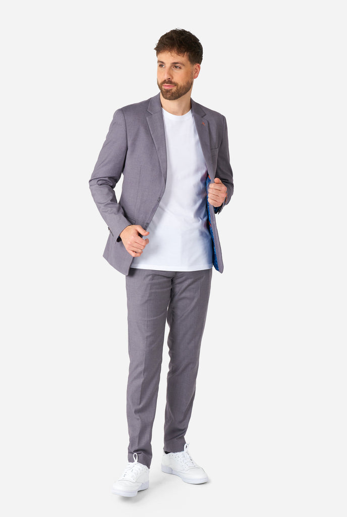 Man wearing casual grey business suit