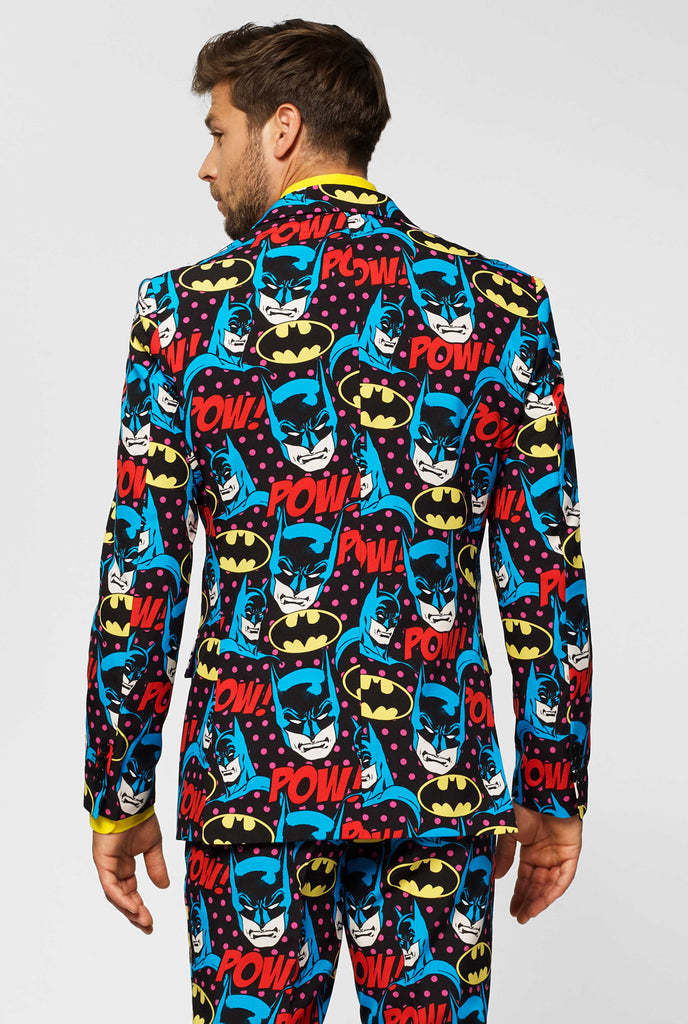 Batman themed men's suit with comic book icons worn by man