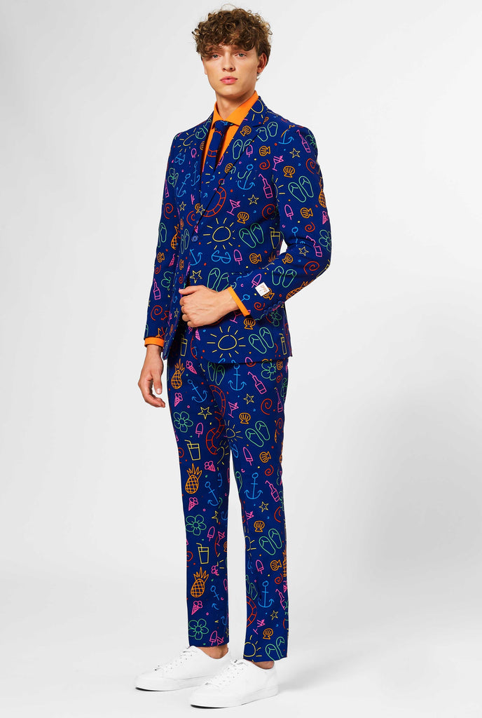 Dark blue men's  suit with bright doodle iconography worn by man