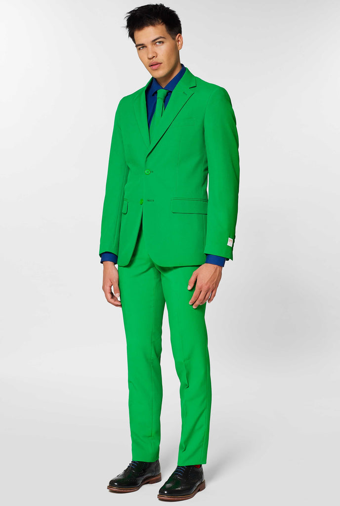 Man wearing green men's suit and dark blue dress shirt