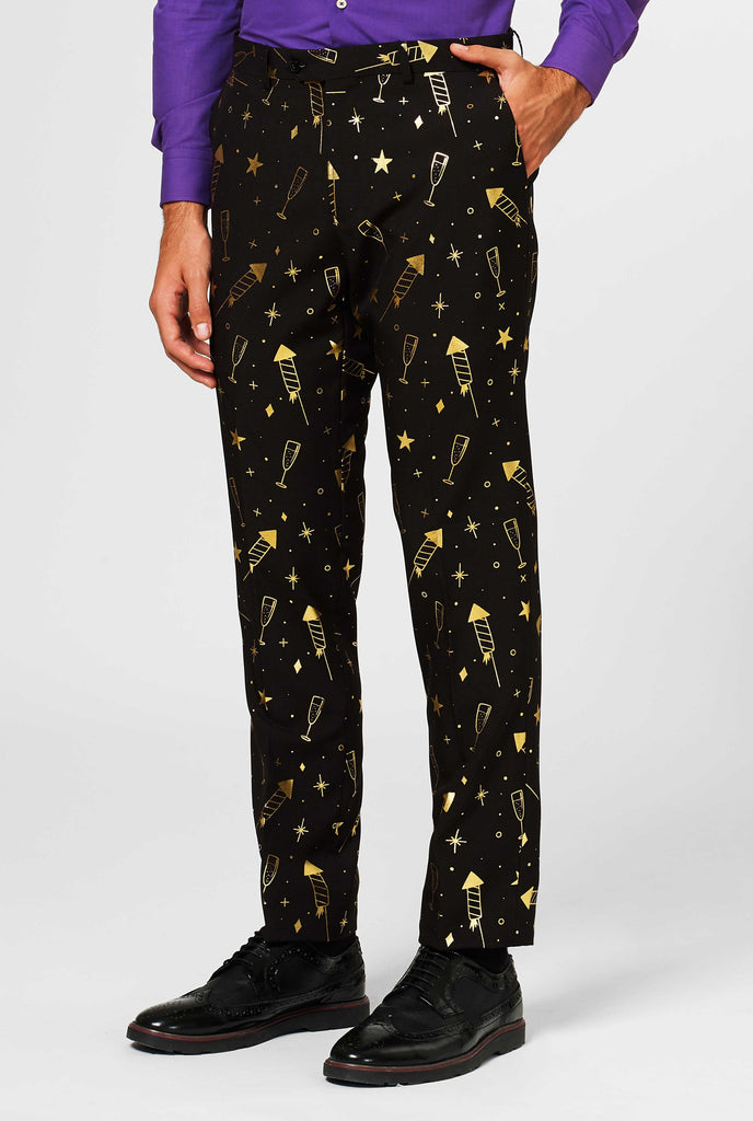 Black pants with golden fireworks print worn by man