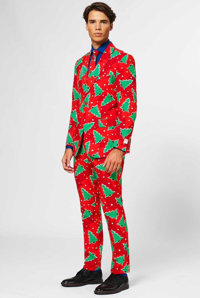 Red Christmas men's suit with pine tree print worn by man