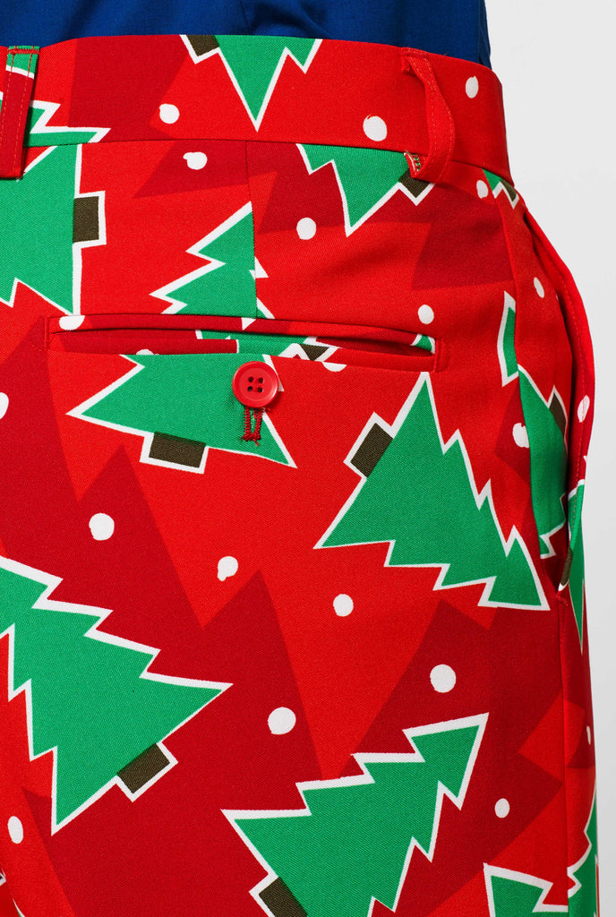 Red Christmas pants with pine tree print worn by man