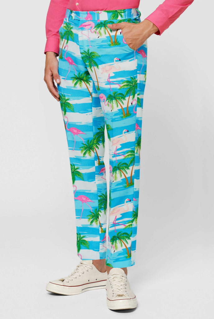 Blue and white suit with tropical flamingo print Flaminguy worn by man up close pants