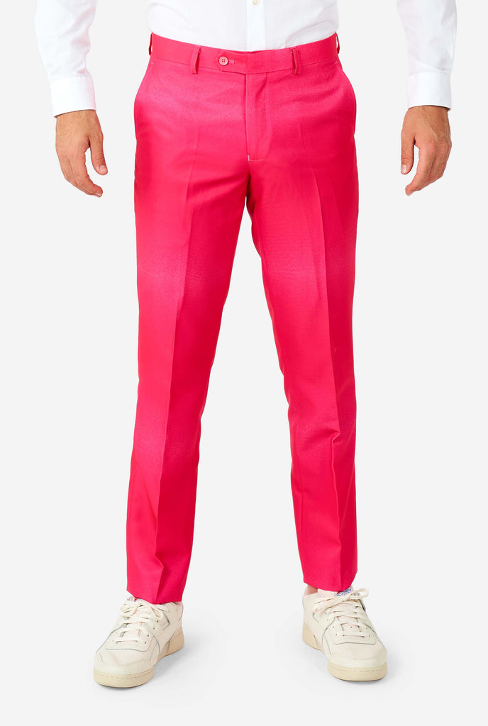 Man wearing rainbow colored suit, zoom on pink pants