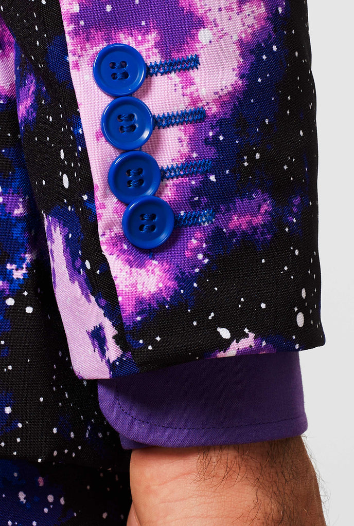 Man wearing suit with galaxy milkyway print, sleeve close up