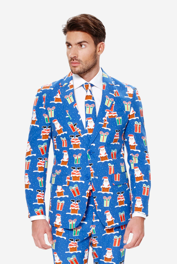 Man wearing blue Christmas suit with Christmas icons