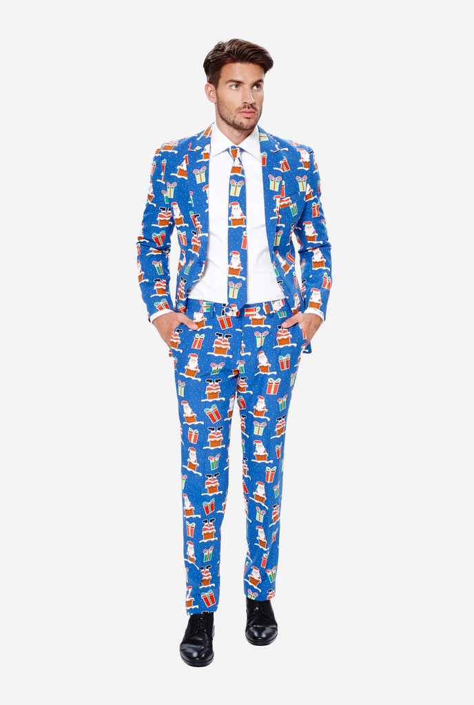 Man wearing blue Christmas suit with Christmas icons