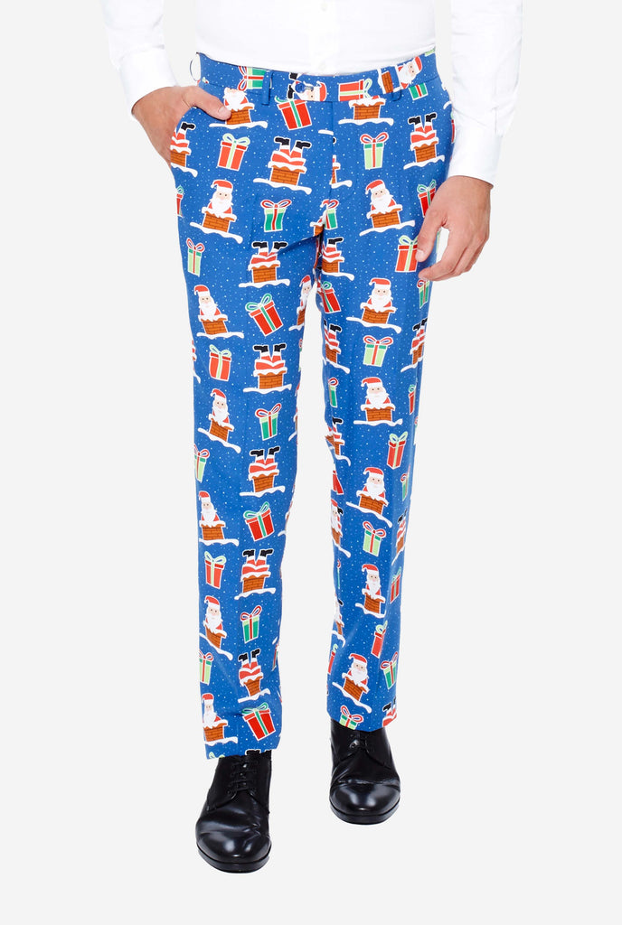 Man wearing blue Christmas suit with Christmas icons, pants close up