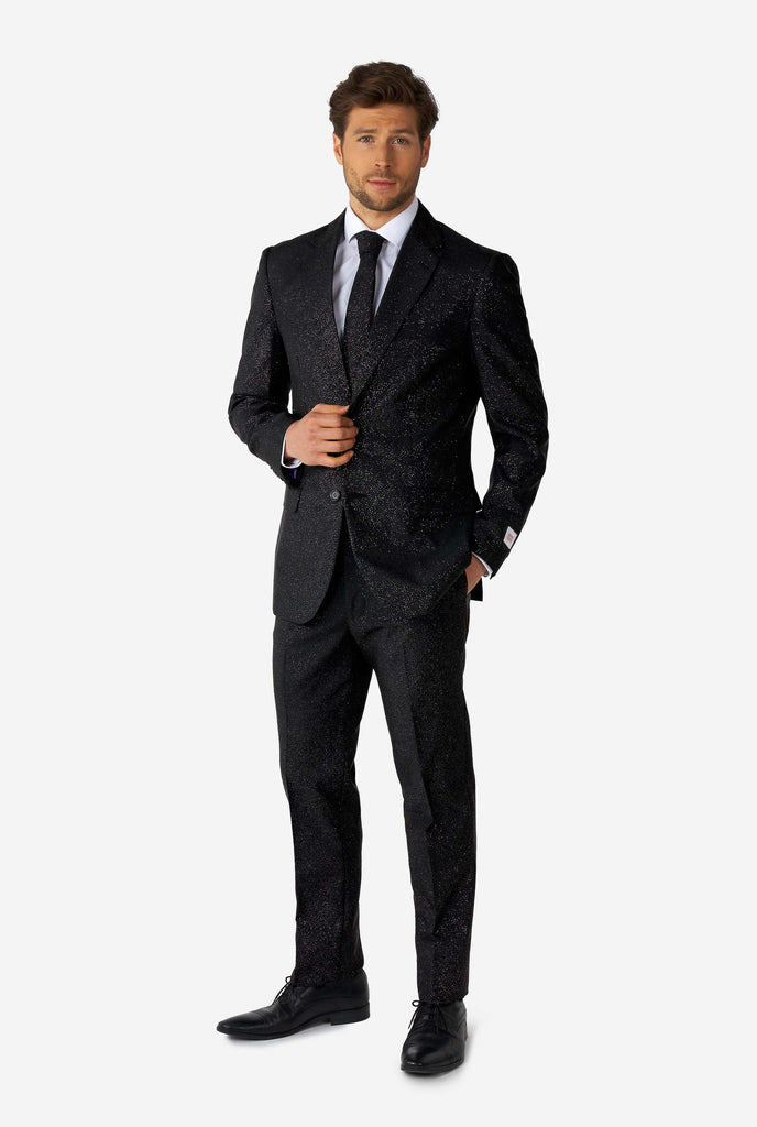 Man wearing black suit with glitter