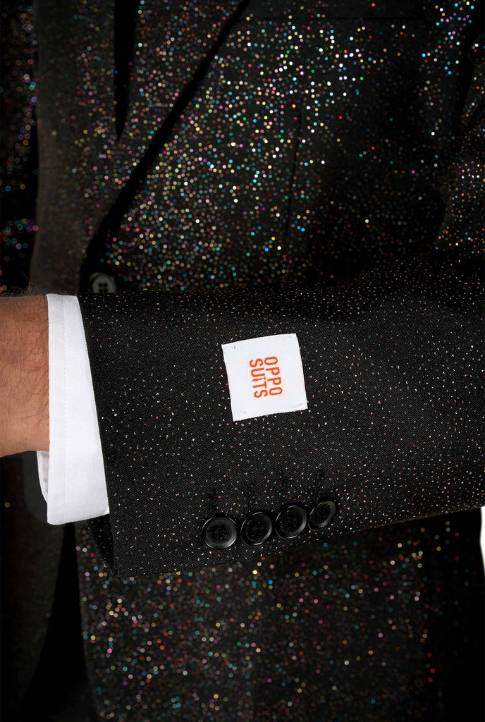 Man wearing black suit with glitter sleeve close up