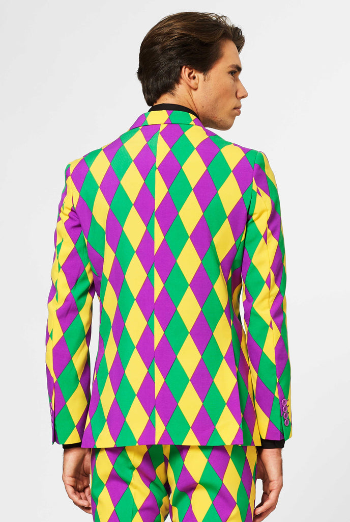 Man wearing men's Mardi Gras suit, view from the back