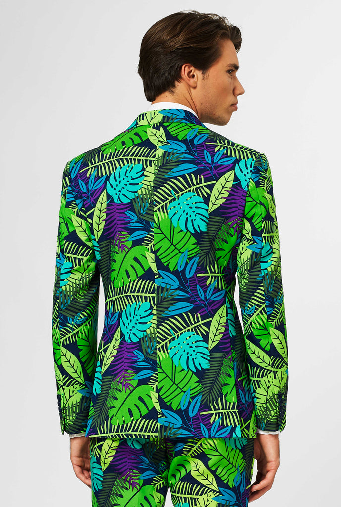 Jungle suit with green and purple leaf print shown from behind