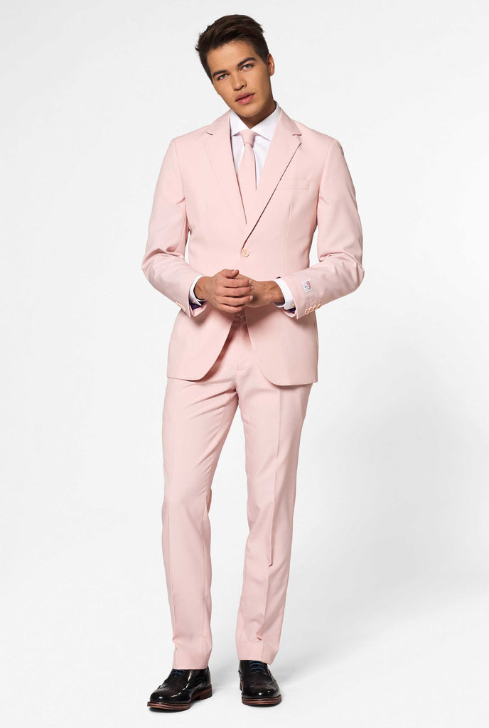 Man wearing pastel pink colored men's suit