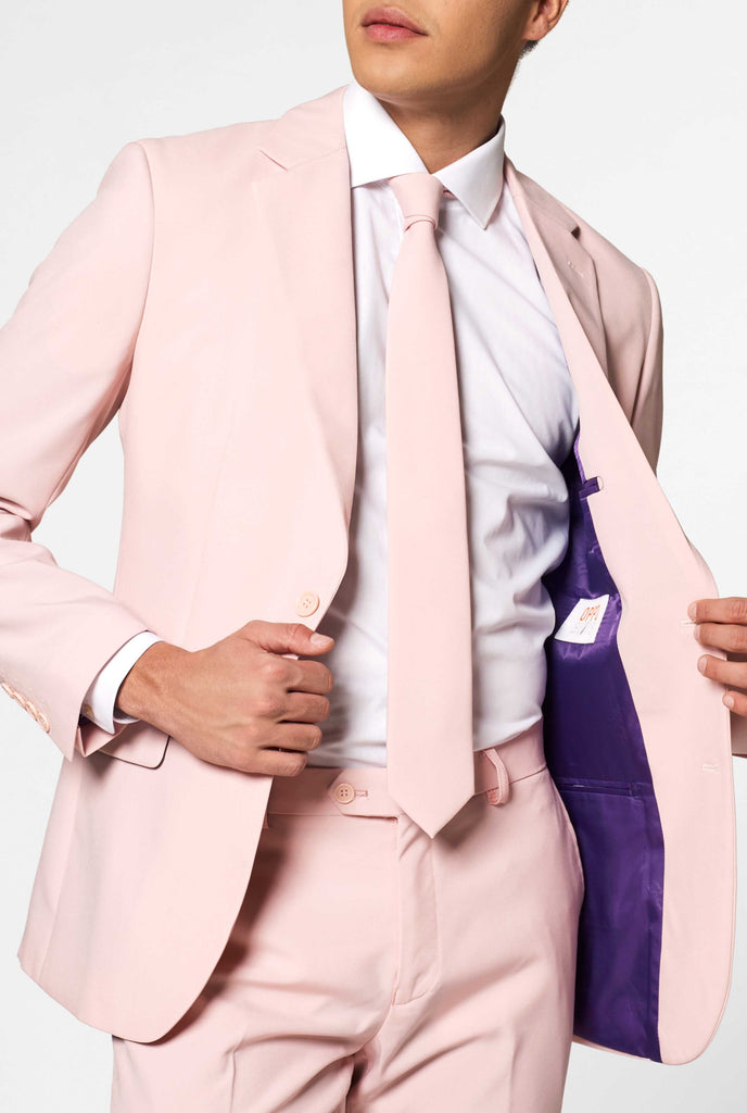 Man wearing pastel pink colored men's suit, close up