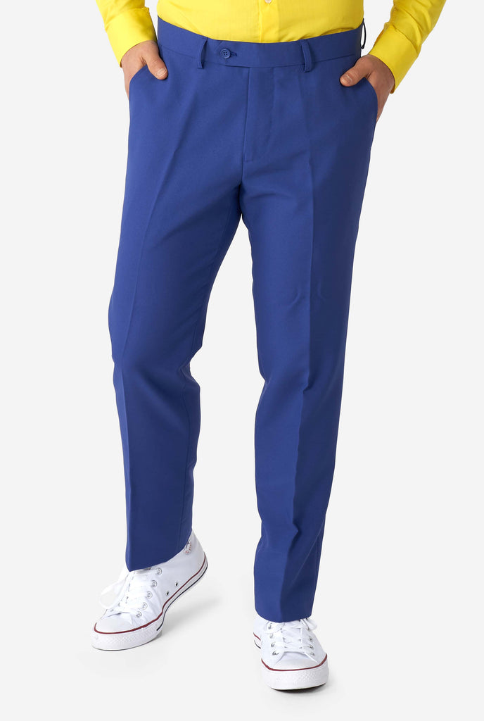 Man wearing blue pants part of Memphis Group retro style men's suit