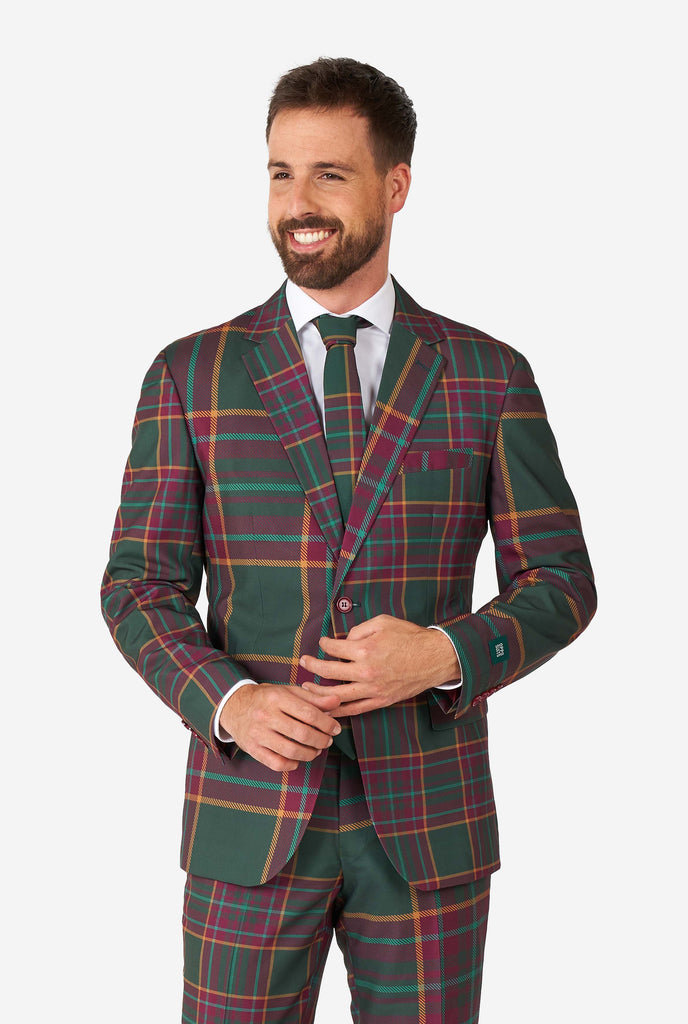 Man wearing a tartan plaid Christmas suit