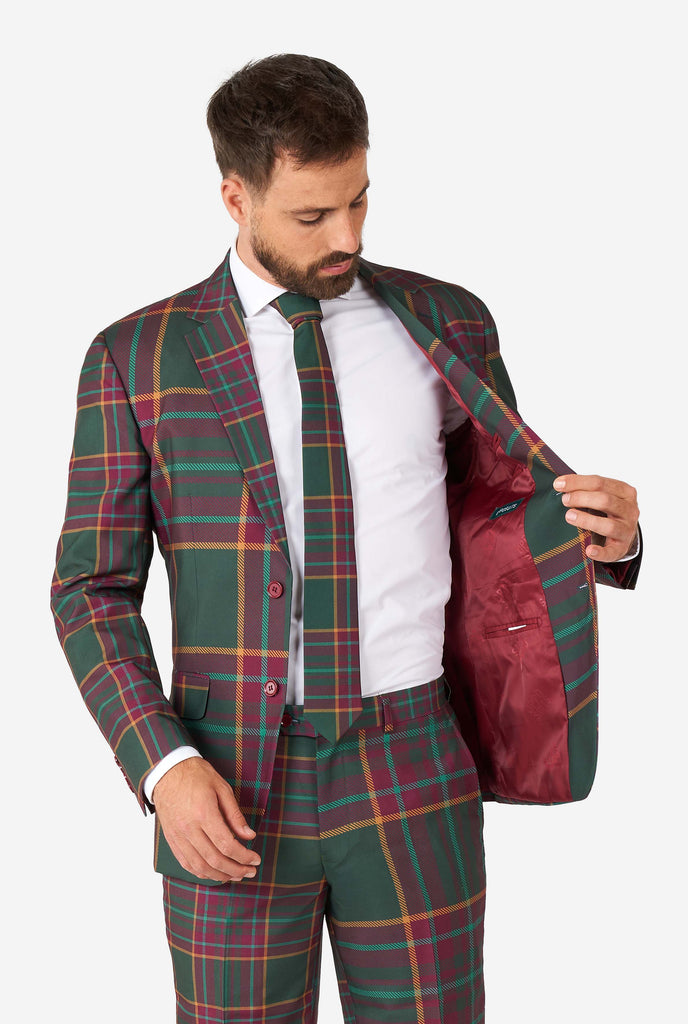 Man wearing a tartan plaid Christmas suit, view jacket inside