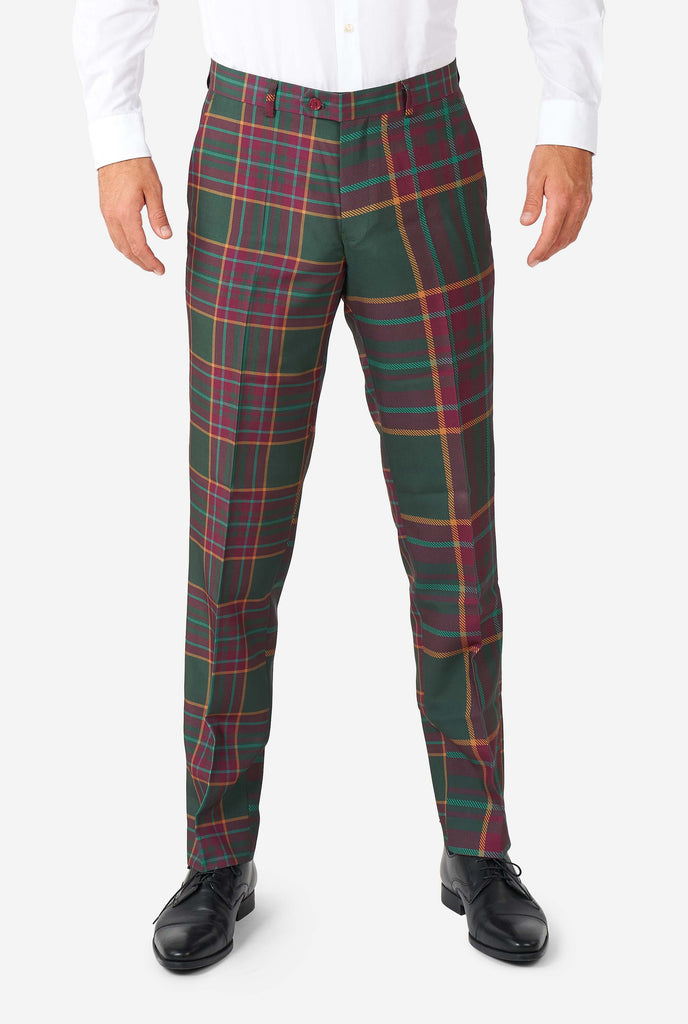 Man wearing a tartan plaid Christmas suit