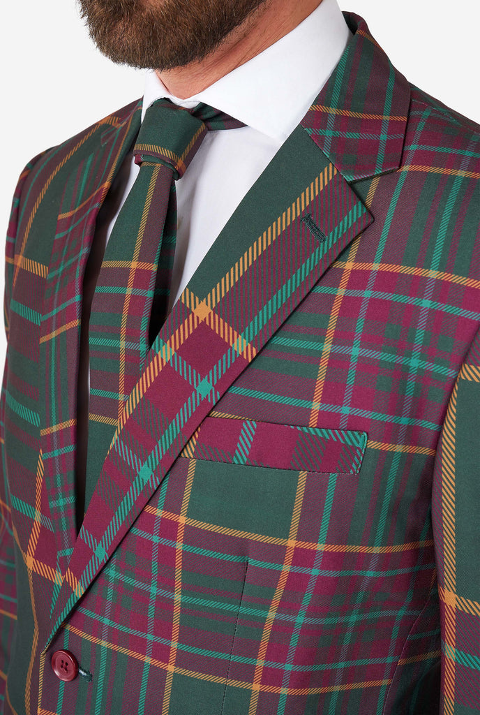  Man wearing a tartan plaid Christmas suit, close up jacket