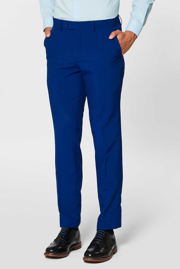 Navy blue solid colored pants worn by man 