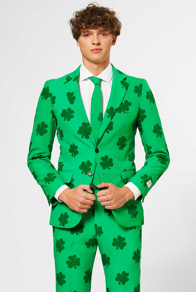 Man wearing green St. Patrick's Day men's suit, with clover print