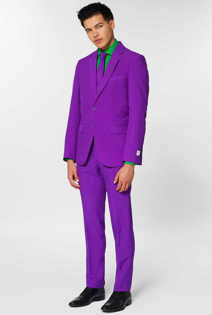 Man wearing purple men's suit and green dress shirt