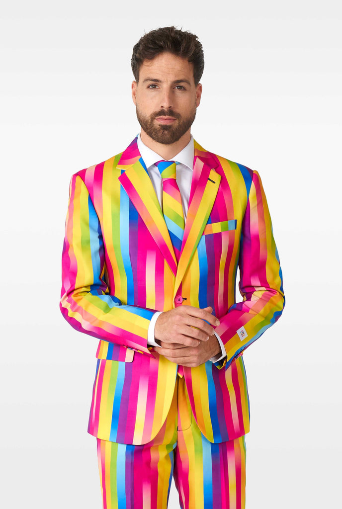 Man wearing rainbow-colored suit