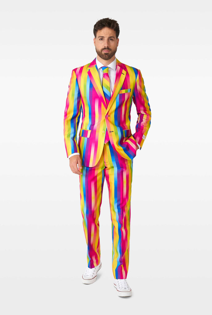 Man wearing rainbow-colored suit