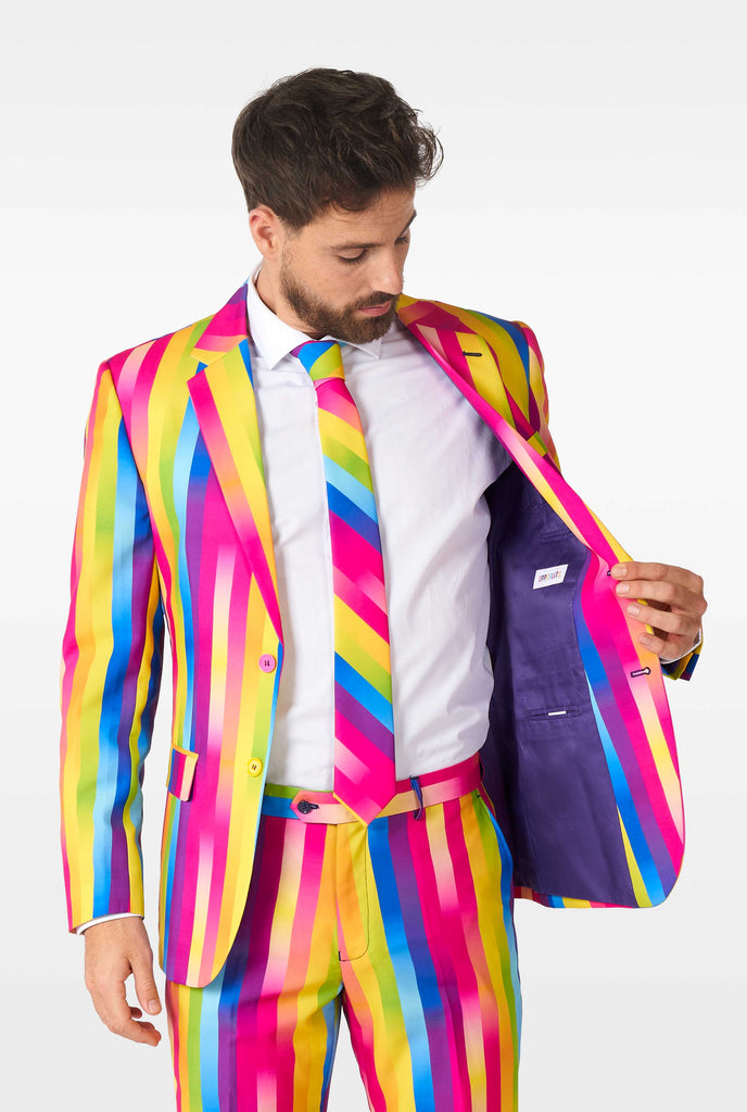 Man wearing rainbow-colored suit