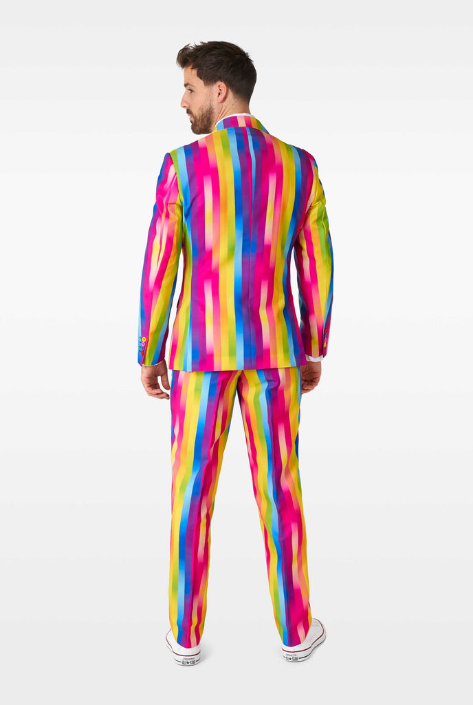 Man wearing rainbow-colored suit view from the back