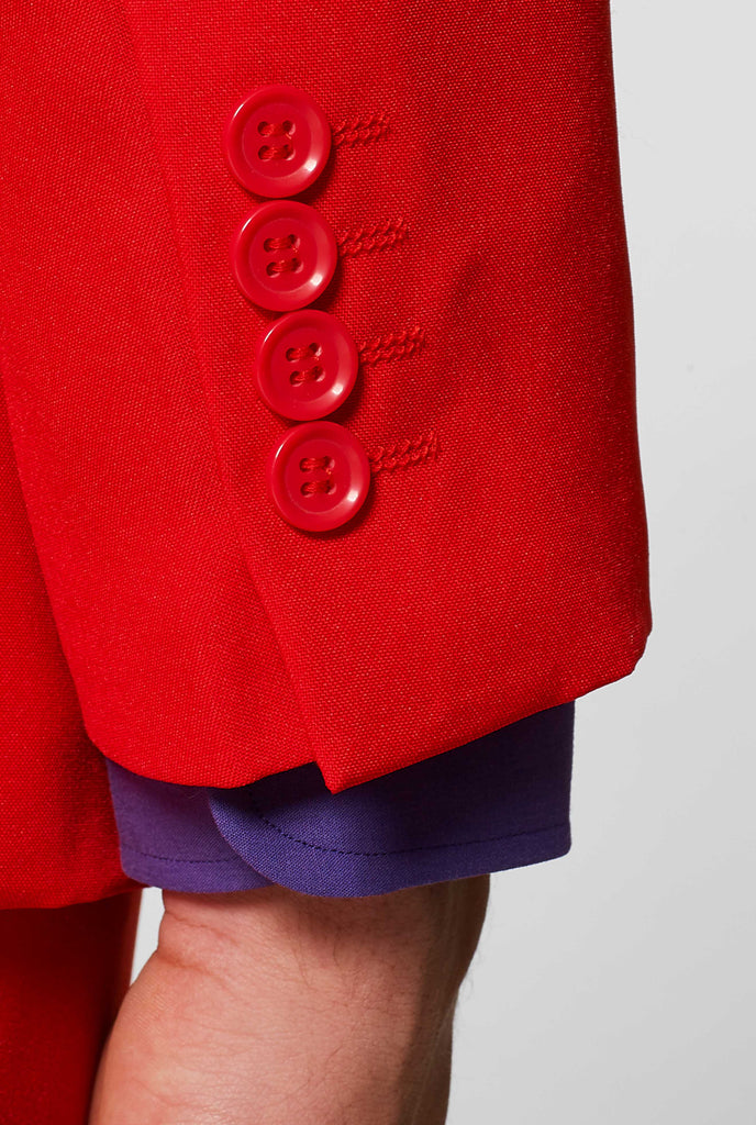 Man wearing red men's suit with purple dress shirt, sleeve close up