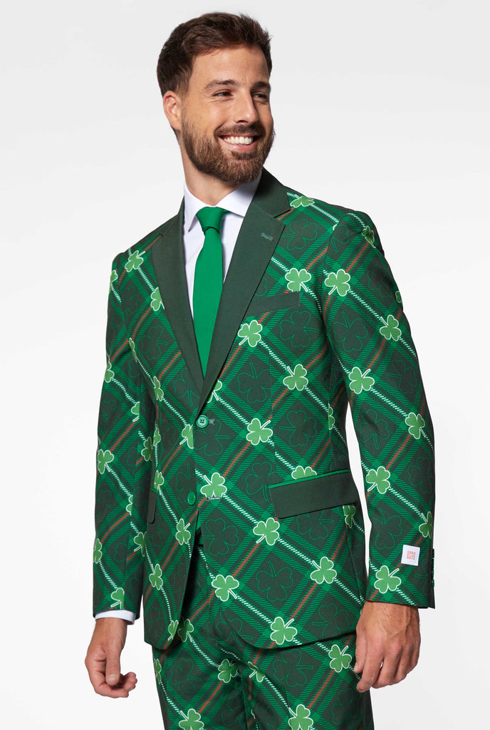 Green plaid men's suit with three-leaf-clovers worn by man