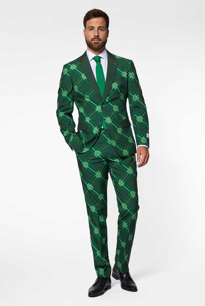 Green plaid men's suit with three-leaf-clovers worn by man