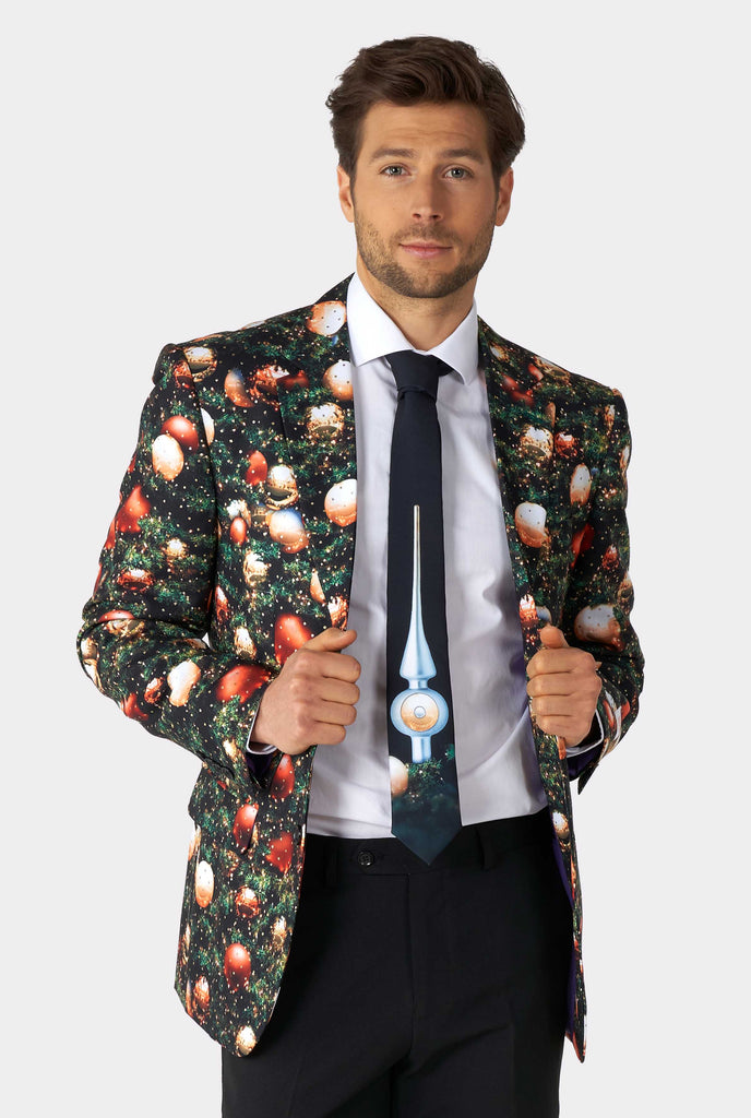 Man wearing Christmas suit with Christmas tree print