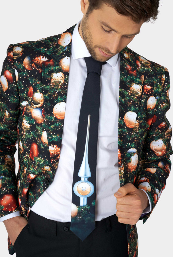 Man wearing Christmas suit with Christmas tree print