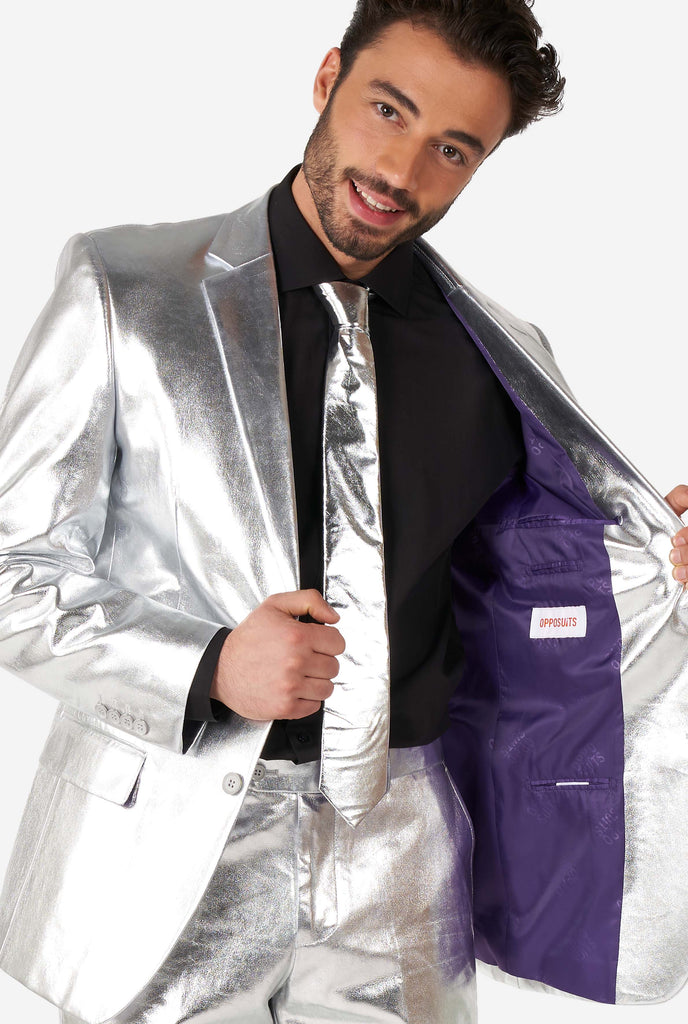 Man wearing shiny silver suit 