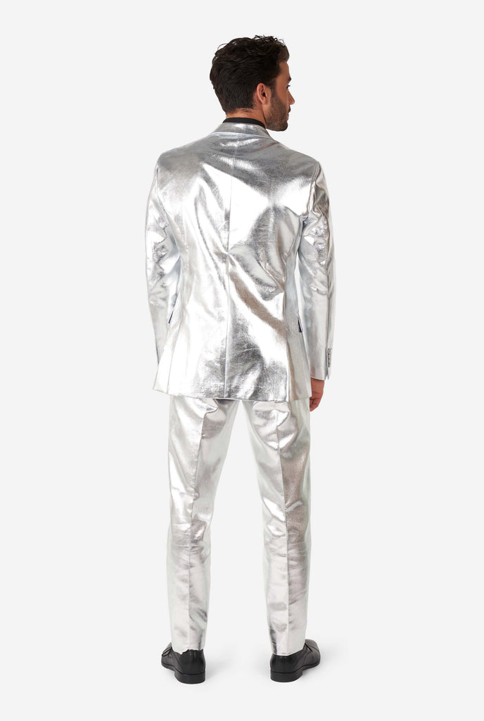 Man wearing shiny silver suit, view from the back