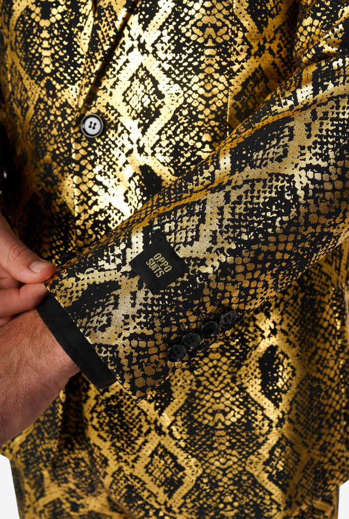 Man wearing suit with, gold and black, snakeskin print, close up