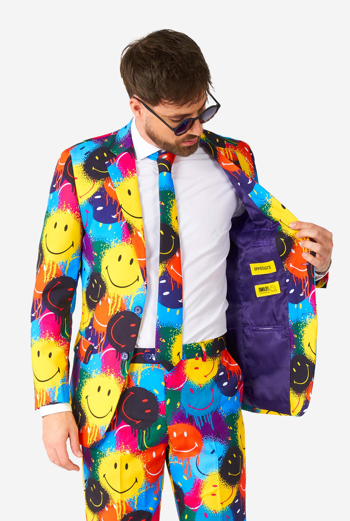 Man wearing colorful men's suit with Smiley print