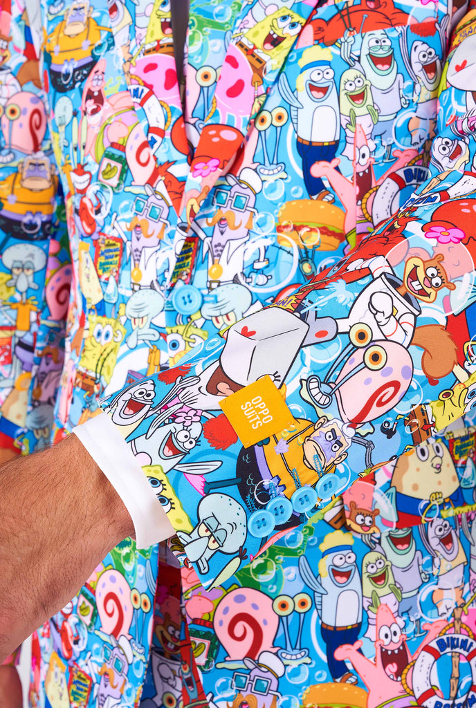 Man wearing men's suit with SpongeBob print, close up sleeve