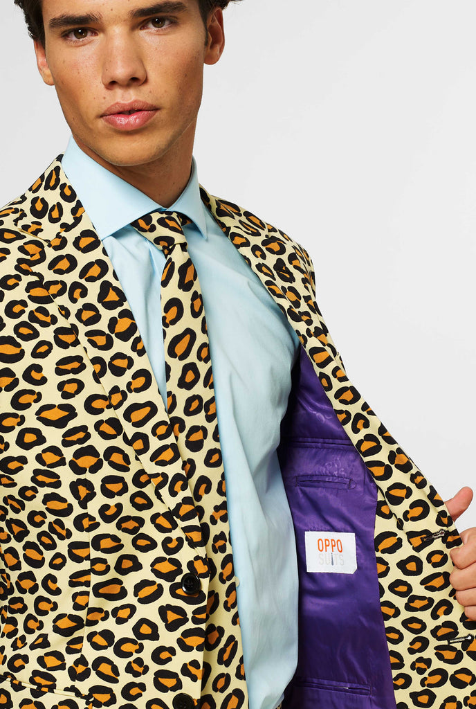 Man wearing men's suit with panther print, close up