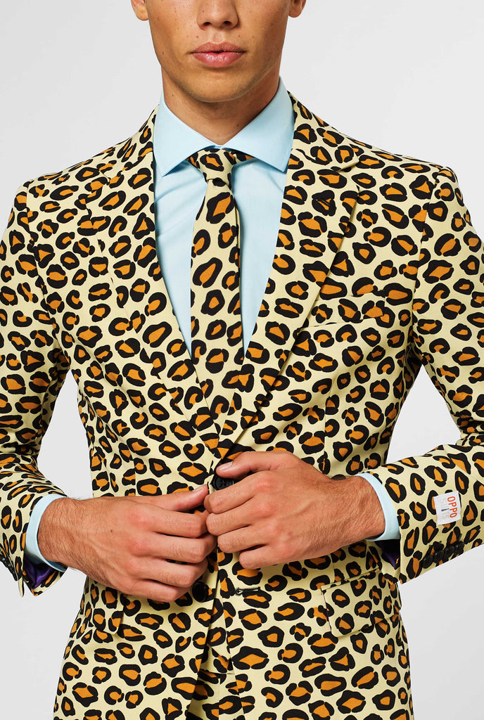 Man wearing men's suit with panther print, close up